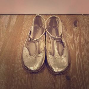 Adorable gold leather T strap shoes from Zara.